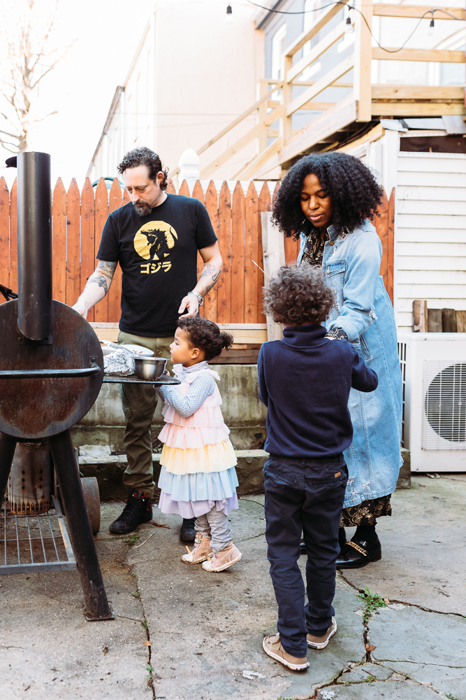 Family preparing s'mores at their Brooklyn family photo session. 