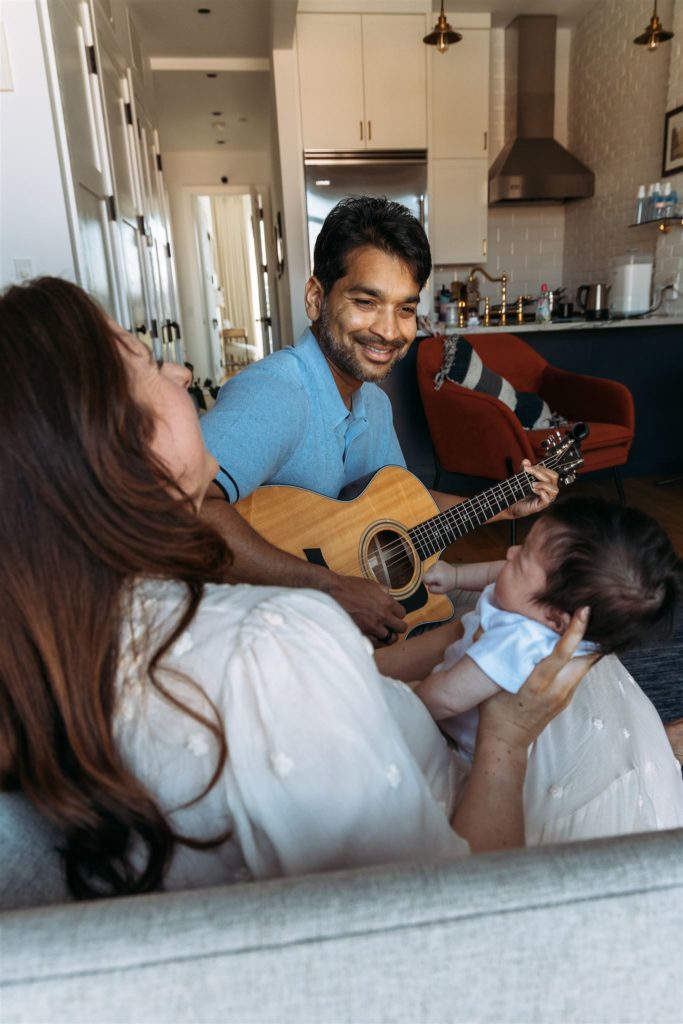 Father, Mother, Newborn Baby, Dad Playing the Guitar for Baby Boy,  NYC Westchester County Newborn Photography
