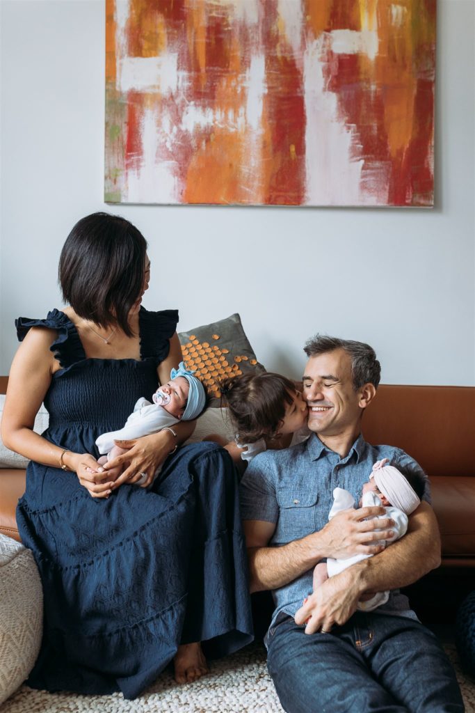 family with twins and their toddler daughter in manhattan nyc apartment