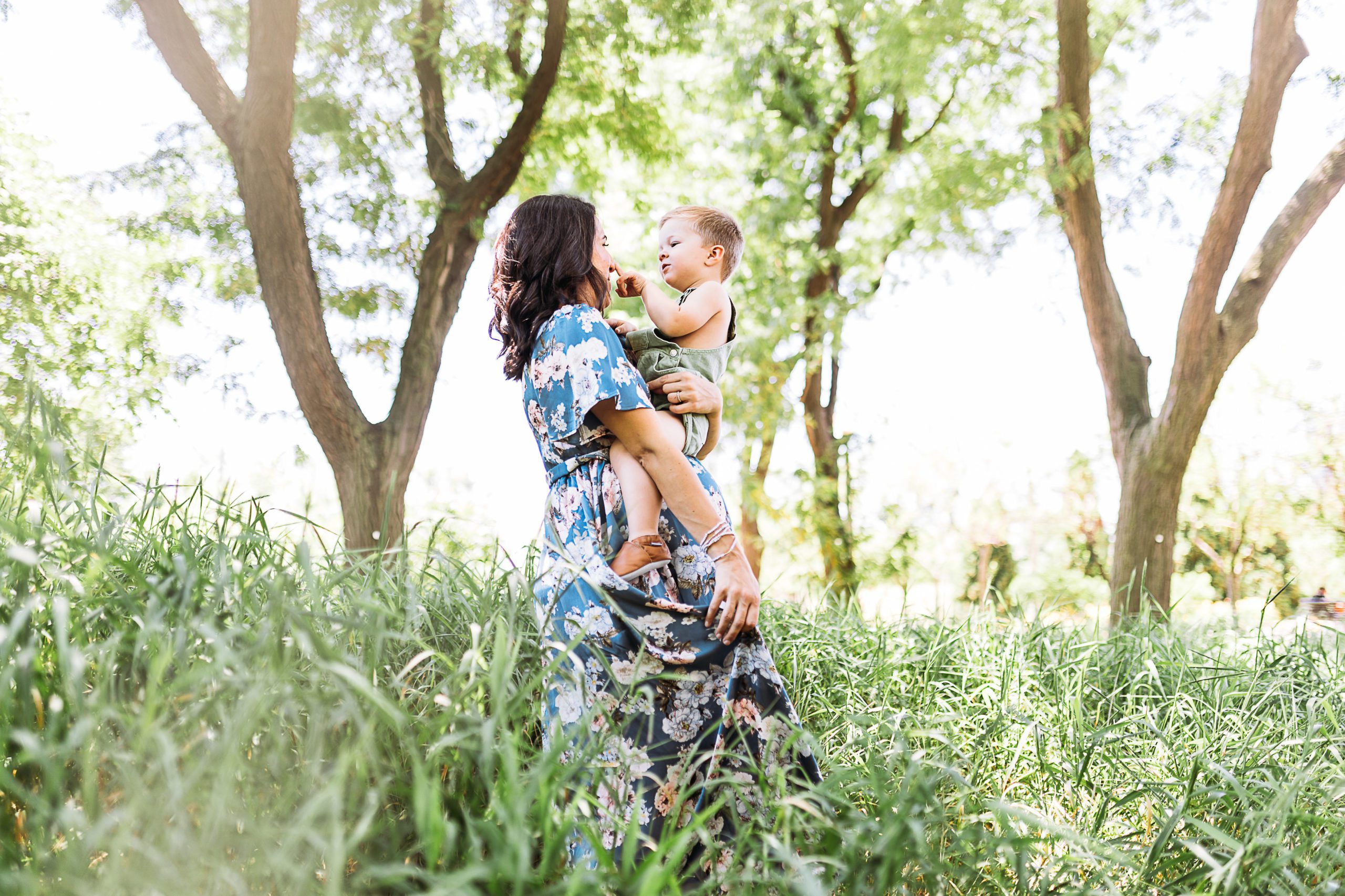 Creative maternity photoshoot with mother and her child in a garden in New York City photographed by their Westchester County Family Photographer, Amy Nghe Photography