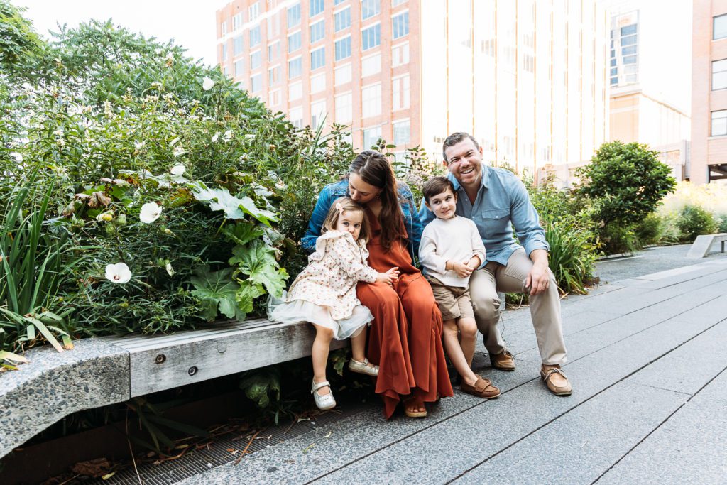This adorable family of four enjoyed their outdoor family photo session in New York City by sitting on a bench taken by their NYC Family Photographer, Amy Nghe Photography